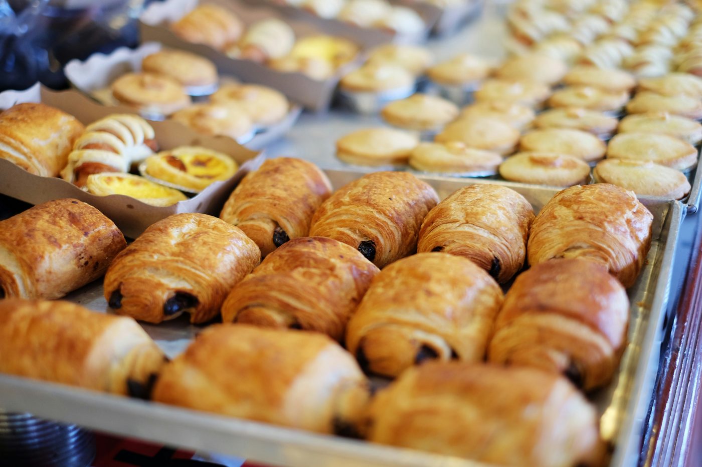 Trays of fresh-baked croissants and pastries