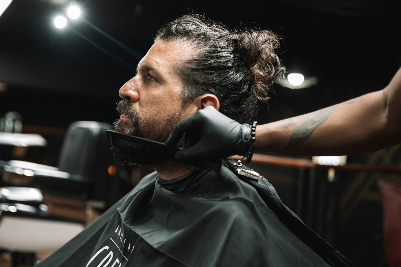 A beard being combed and trimmed